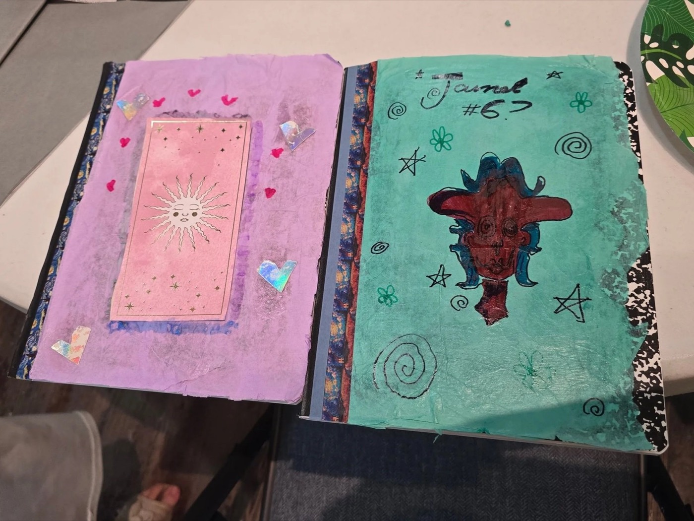 A journal page bursting with hearts, stickers, and doodles.