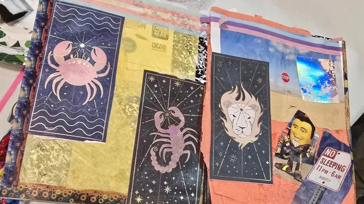A zodiac-themed collage journal spread made at an Art Inclusive session
